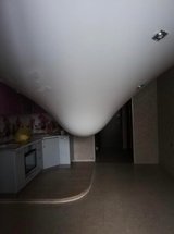 ceiling water leak over an empty room.